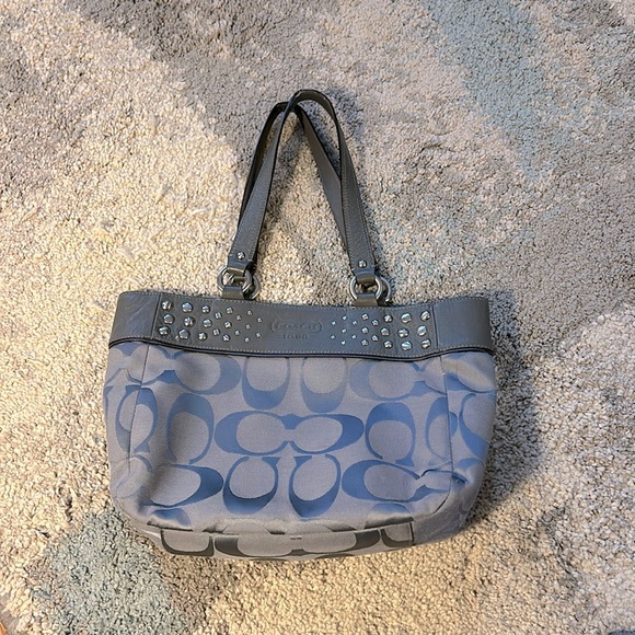Gray Coach bag with purple lining. Gently used. 11h x 9w x 4w x 2.5. Straps, 19” - Picture 1 of 6